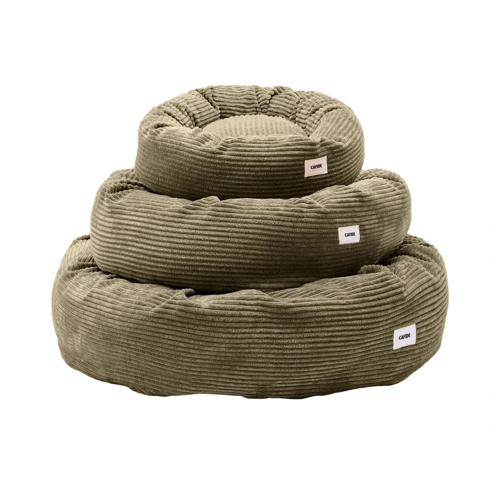 Cama redonda para perro Nuba verde de CAFIDE en diferentes tamaños con tejido acanalado y diseño acolchado