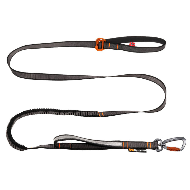 Correa para perros Non-stop Dogwear Touring Bungee Adjustable negra con sección elástica, mango acolchado y mosquetón Twistlock