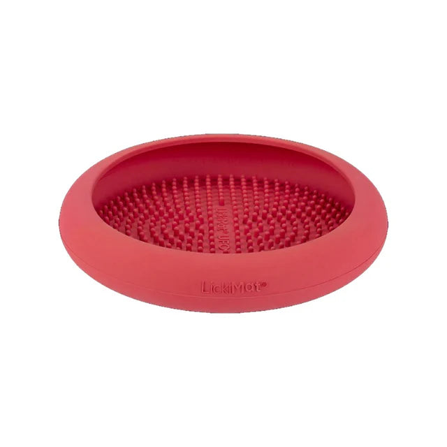 LickiMat UFO morado con ventosas en la base para alimentación lenta y reducción del estrés en perros